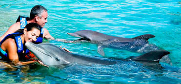 Tour a Xcaret y Nados con delfines| Tours en Cancun y Riviera Maya 