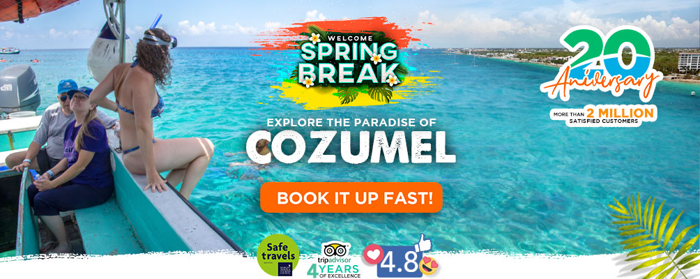 woman swiming in the sea of cozumel reef
