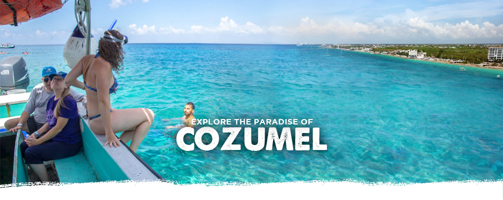 woman swiming in the sea of cozumel reef